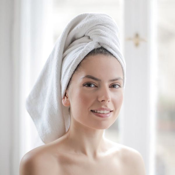 Person looking focused and serene after a morning wellness routine.